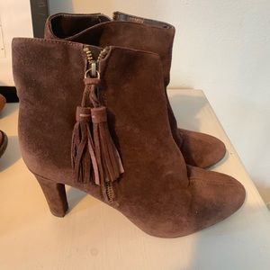 Anne Klein booties in brown suede with tassels.